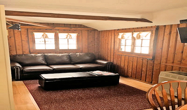  Cabin Two Living Room with Leather Sofa Bed and Storage Ottoman